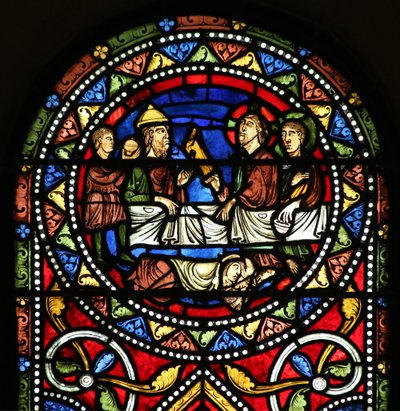 Window depicting the Charity of St Nicholas. He pays for a sick man