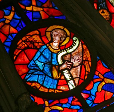 Window w141 depicting a musician angel with a harp by French School
