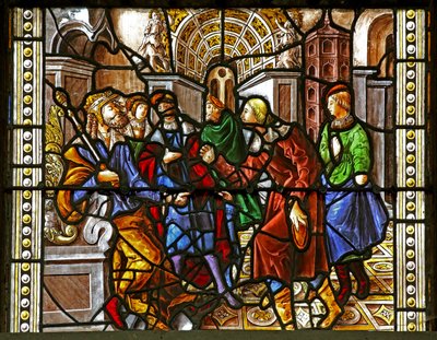 Window depicting St Thomas in India is invited to the wedding of Pelagius, is beaten by a servant who is in turn eaten by a lion. A dog brings in the servant