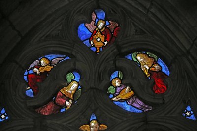 Window depicting angel musicians and the Host by French School