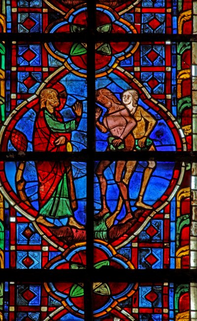 Window depicting Adam and Eve admonished for eating fruit by French School