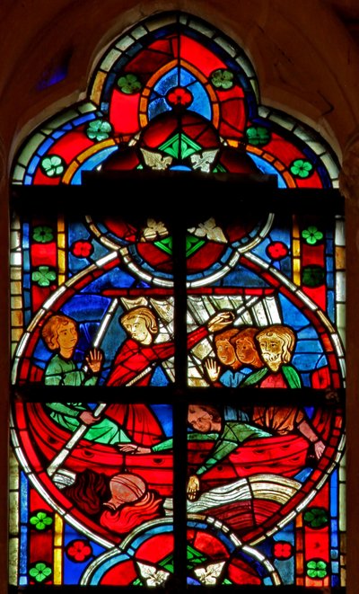 Window depicting a scene from a legend of St Nicholas: a devil gives travellers a liquid but the flask is lost overboard by French School