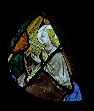 Window depicting a musician angel with a harp by French School