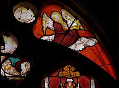 Window depicting a musician angel with an organ by French School