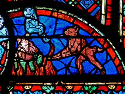 Window depicting an impenitent being tormented by demons by French School