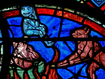 Window depicting an impenitent being tormented by demons by French School