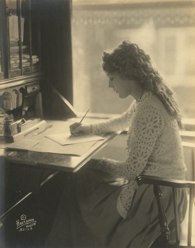 Mary Pickford writing at a desk by Bartolome Esteban and studio Murillo