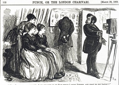 A pompous portrait photographer asking the impossible of the subject by George du Maurier
