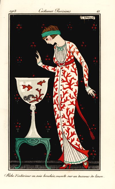 Woman in house gown of coral-print silk over a linen petticoat. Aquarium with coral and goldfish by Georges Barbier
