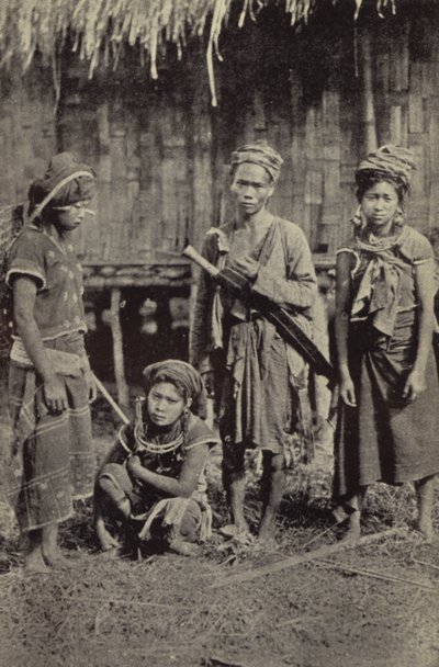 Burma: A Kachin man with the characteristic dah, and three women by Georges Bertin Scott