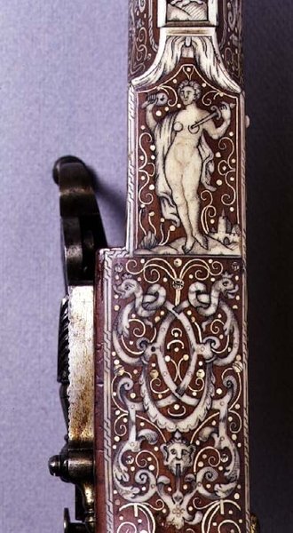 Handle of a wheel-lock rifle decorated with ivory figures and arabesques by German School
