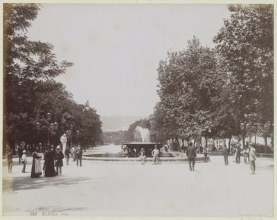 Square with a Fountain and Strolling People in Naples by Giorgio Sommer