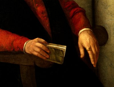 Presumed portrait of Francois Rabelais, French writer and doctor. Detail of the book he holds in his hand and of the knight he carries on his finger by Giovanni Battista Moroni