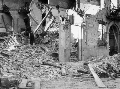 The bombardments of Sermide. Two people amongst the rubble of a destroyed building by Giulio Anderlini