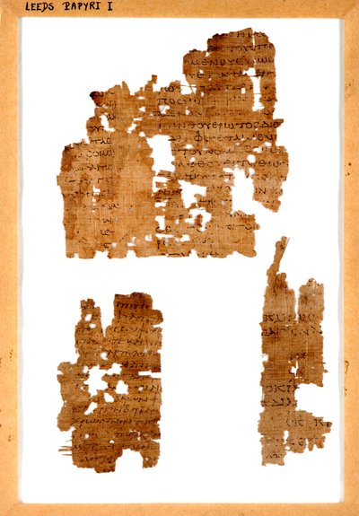 Three fragments of unrelated papyrus mounted in a frame by Greek