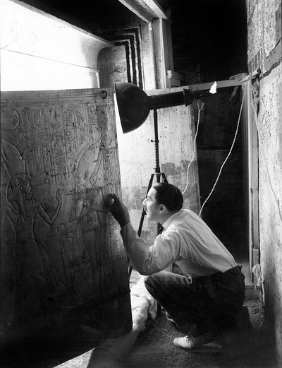 Discovery of the Tomb of Pharaoh Tutankhamun in the Valley of the Kings (Egypt): Howard Carter Looking Through the Doors of the Second Shrine, January 4 by Harry Burton