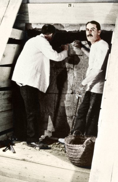 Howard Carter and a colleague excavating a tomb in the Valley of the Kings, Egypt by Harry Burton