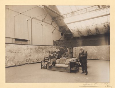 Claude Monet in front of his paintings 