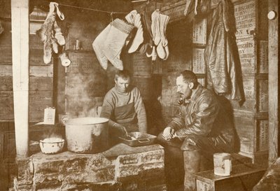 Meares and Demetri at the Blubber Stove in the Discovery Hut, 3 November 1911 by Herbert Ponting