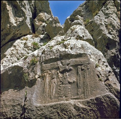 Low relief with a character under a winged creature by Hittite