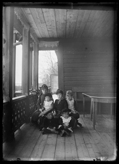 Elma Simberg and Other Relatives on the Porch of the Yellow Villa by Hugo Simberg
