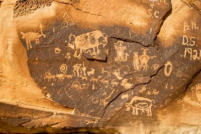 A petroglyph on a boulder with a bison and another pregnant bison at Willow Bend on..., 2005 by Ira Block