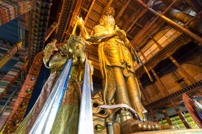 A statue of Migjid Janraisig at Gandantegchinlen Monastery, a Tibetan-style monastery by Ira Block