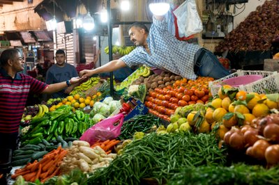 A vendor in a souk in Fes, Morocco (photo) by Ira Block