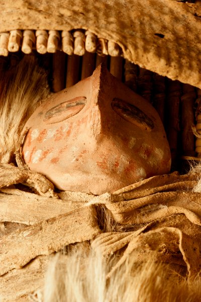 At the College of Eastern Utah Prehistoric Museum in Price, Utah, a miniature Fremont cradle board with a ceramic figurine found in the 1930s at the Capitol Reef area by Ira Block