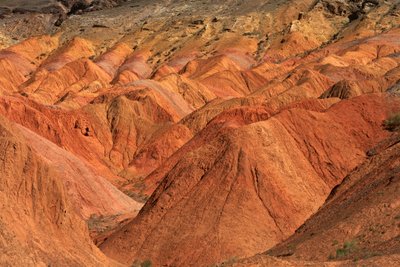 At the colored rocks near the campsite at Wu Cai Wan in the Gobi desert, Xinjiang..., 2007 by Ira Block