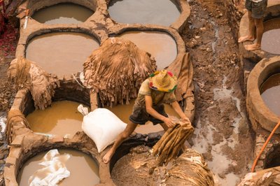 Hides being dyed at the Chouara tannery in Fes, Morocco by Ira Block