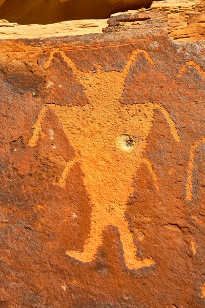 Near Vernal, UT at McKee Springs, Fremont petroglyphs showing warriors holding trophy heads by Ira Block