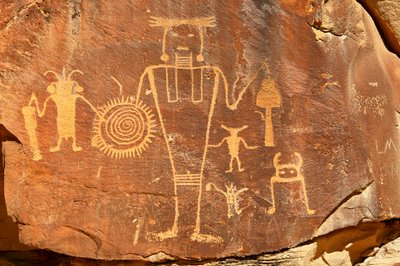 Near Vernal, UT at McKee Springs, Fremont petroglyphs showing warriors holding trophy heads., 2005 by Ira Block