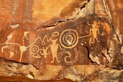 Near Vernal, UT at McKee Springs, Fremont petroglyphs showing warriors holding trophy heads., 2005 by Ira Block