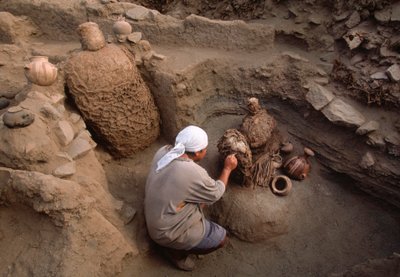 Richard Gomez cleaning newly discovered artifacts at the school dig site by Ira Block