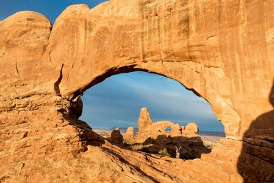 Sunrise Light on Window Arch at Arches National Park Located Just Outside of Moab, Utah by Ira Block