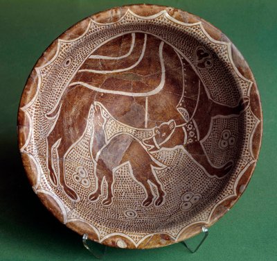 Islamic art: cut to the camel nursing her baby. From Iraq. 10th century. Paris, Louvre Museum by Islamic School