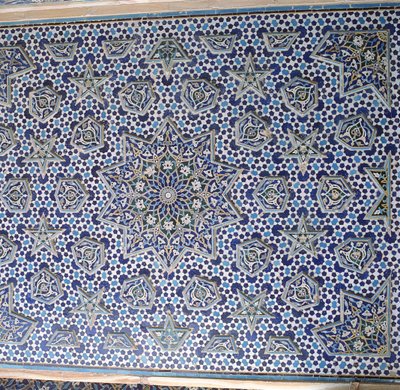 North portal tile panel, one of a pair with protruding palmettes and stars encircling the central sun medallion by Islamic School