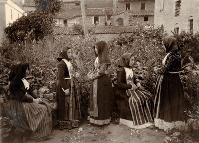 Group of women wearing traditional costumes in garden, Sardinia, Italy by Italian Photographer