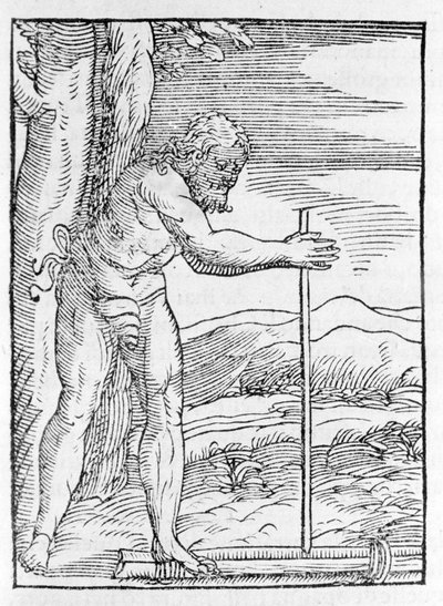An Indian Tainos lighting a fire by rubbing two pieces of wood. Engraving from 