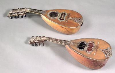 Neapolitan four double stringed mandolin and a Milanese six double stringed mandolin by Italian School