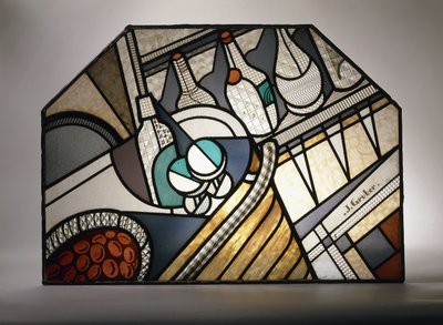 An Art Deco stained glass panel depicting a cocktail bar by Jacques Gruber