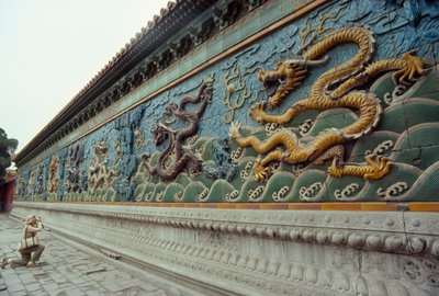 Woman photographs the Nine-Dragon Screen in Beihai Park, Beijing by James L Stanfield