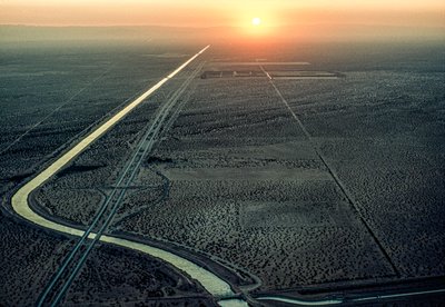 Aerial view of the All-American Canal as the blazing sun sets in the west by James L Stanfield