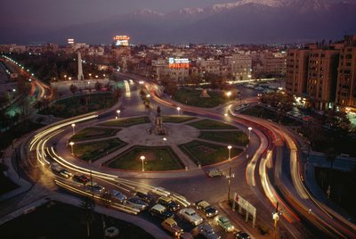 Car, city lights illuminate Plaza Baquedano, Santiago, Chile by James L Stanfield