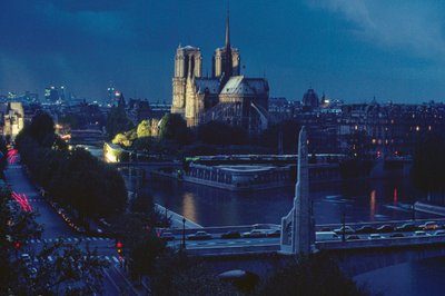 Exterior view of Notre Dame at night. Paris, France by James L Stanfield