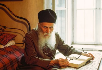 Portrait of an Eastern Orthodox Priest, Reading, Rila Monastery, Rila, Bulgaria by James L Stanfield