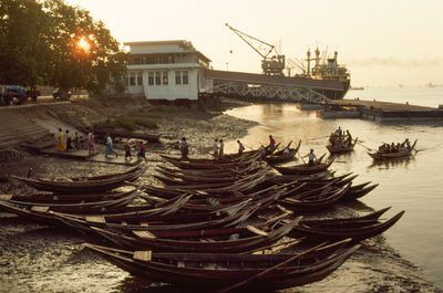 Sampans Crowd the Muddy Beach at Nantira Jetty, Rangoon, Burma by James L Stanfield