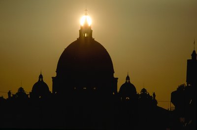 Sunset behind the dome of Saint Peter