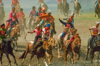 Youngsters in a horse race at a summer festival held near Ulaanbaatar by James L Stanfield
